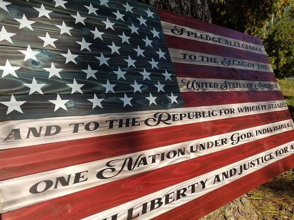 This is the same hand-crafted flag as the "Rustic Flag", except we have painted the Pledge of Allegiance onto the white stripes on this one. Crisp edges. No vinyl. All hand painted. Average turnaround time: 2-4 weeks. 