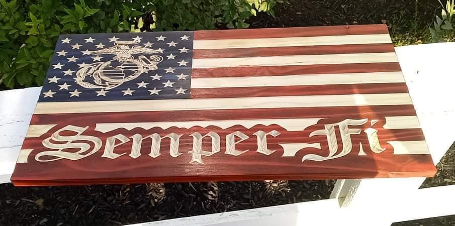 This carved wooden flag has all the stripes, stars, marines logo, and semper fi engraved directly into the wood.  It is colored by hand and sealed for easy cleaning.  It is truly a one-of-a-kind item. 